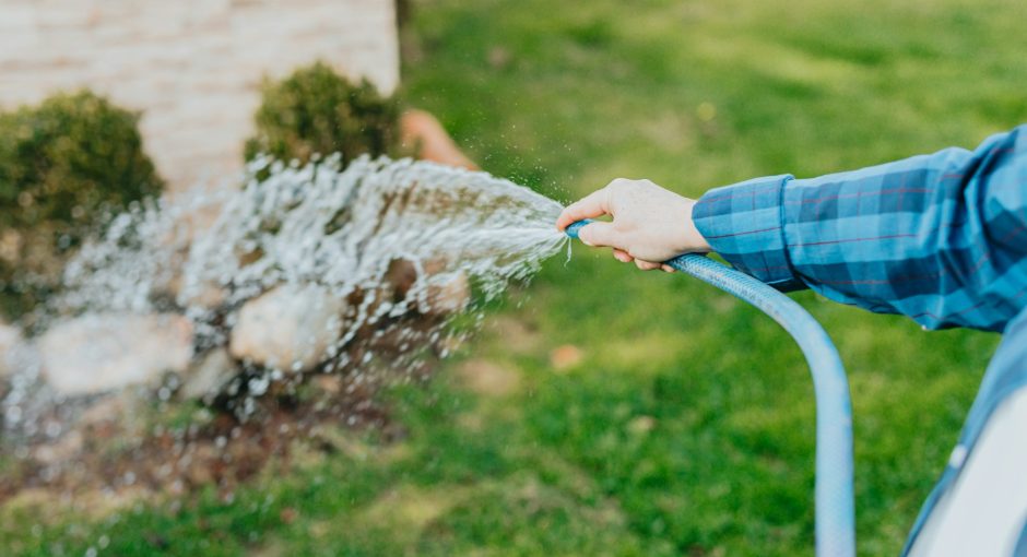 a-person-is-spraying-water-from-a-hose